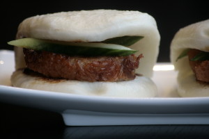 C1 Siu Ab Bao Roasted duck on a steamed Mandarin bun, served with cucumber and hoisin sauce.