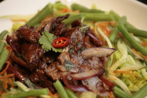 I3 Yam Nua Beef, Thai basil, onion, baby gem, cucumber, string beans, cherry tomatoes, lime, fish sauce, pepper and coriander.